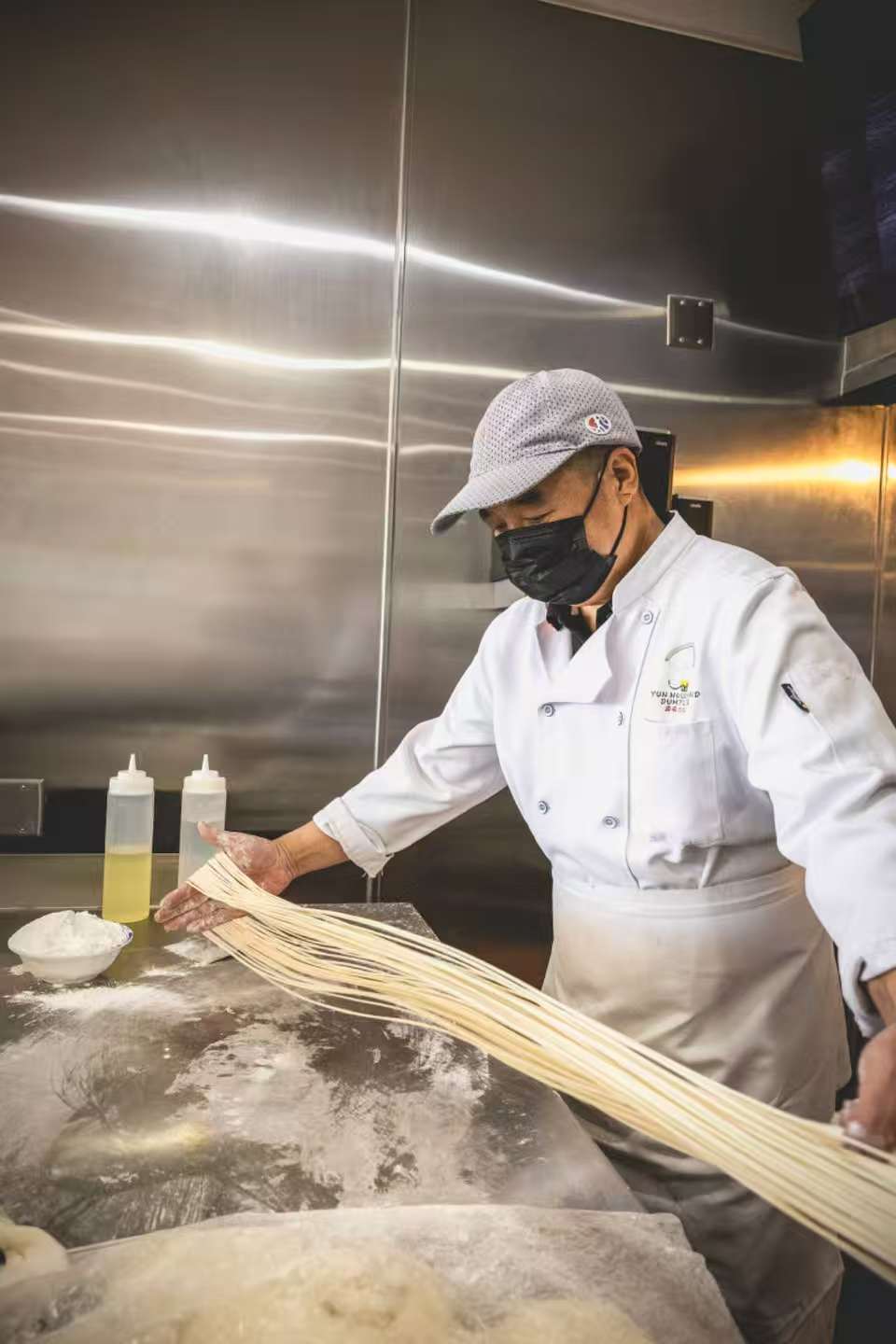 Noodle strands laid on the floured counter